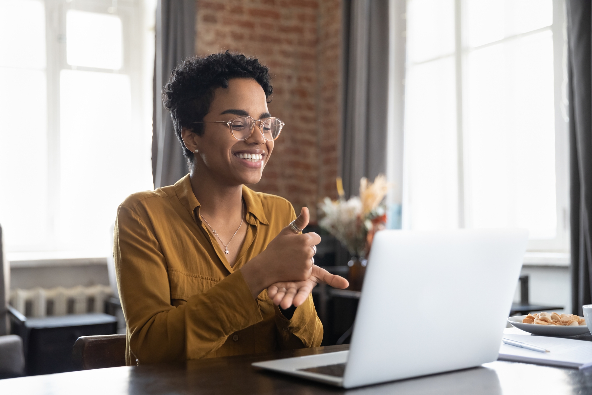 Woman Learning Sign Langauge On Her Laptop